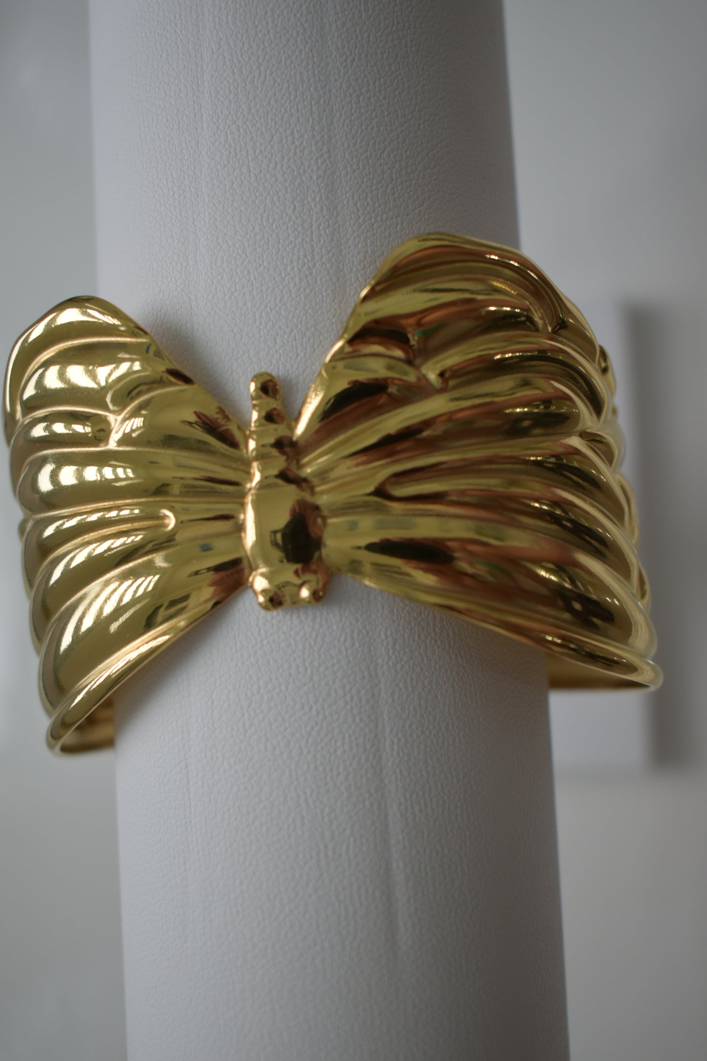 Gold bracelet on a white background