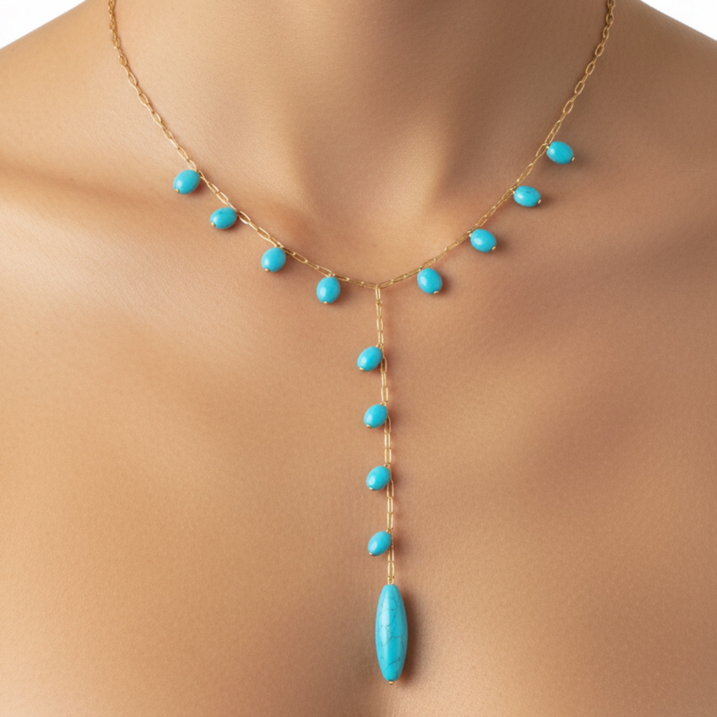 Turquoise necklace with gold chain on a mannequin
Nine Blue Necklace with multiple blue gemstone pendants in gold plated chain - Product display on white background