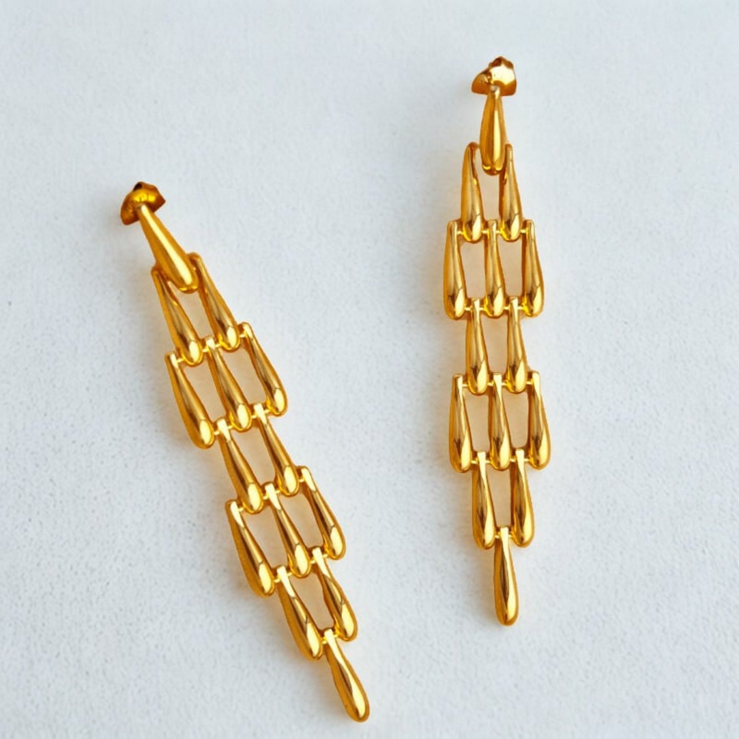 Drops of The Yunque Earrings - elegant drop earrings inspired by El Yunque rainforest by SIETE Y UNO
Gold chain-style earrings on a light gray background