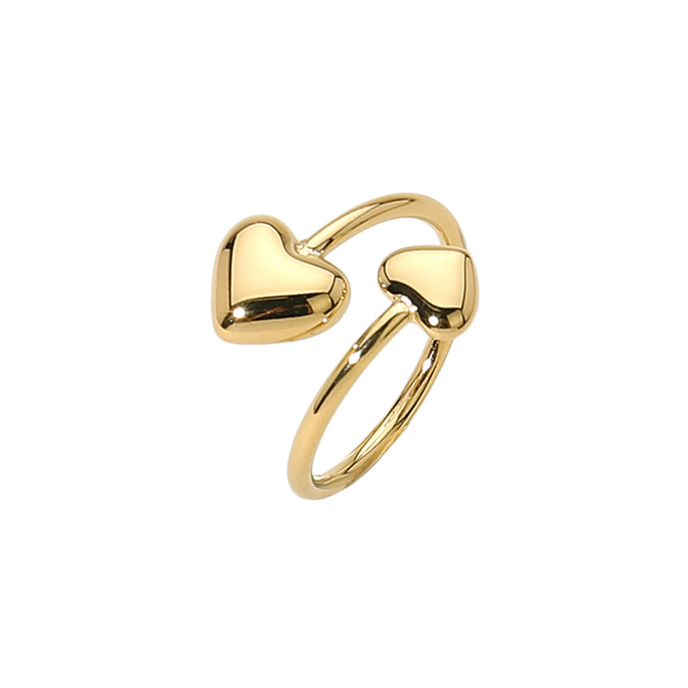 Heart Ring - adjustable gold stainless steel heart-shaped ring by SIETE Y UNO
Gold ring with heart-shaped designs on a white background