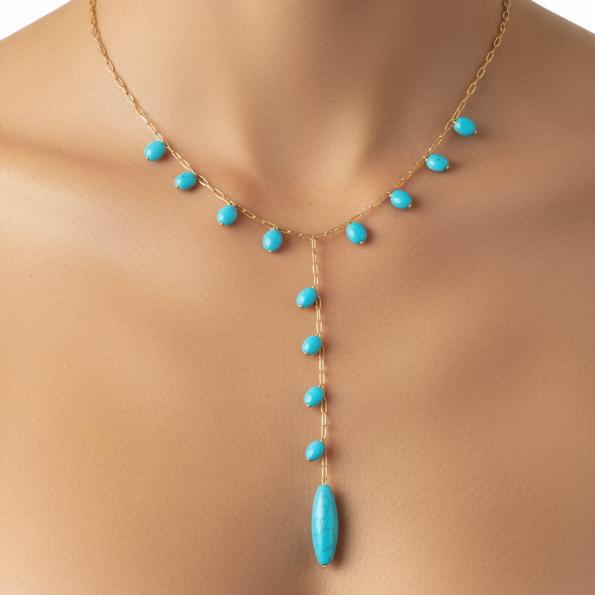 Turquoise necklace with gold chain on a mannequin
Nine Blue Necklace with multiple blue gemstone pendants in gold plated chain - Product display on white background
