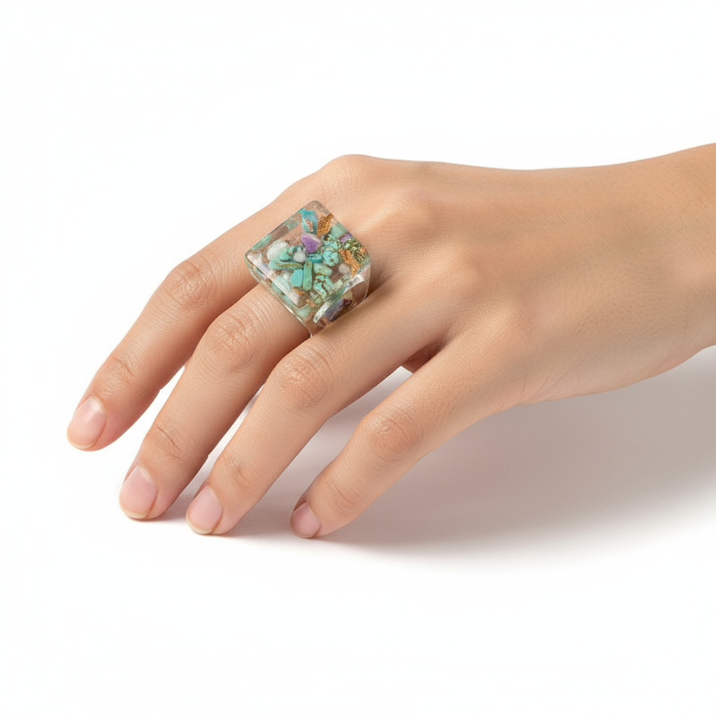 Geometric Ring - modern minimalist design ring by SIETE Y UNO
Hand wearing a colorful ring on a white background