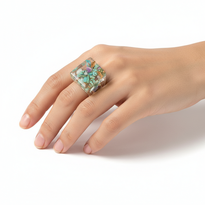 Geometric Ring - modern minimalist design ring by SIETE Y UNO
Hand wearing a colorful ring on a white background